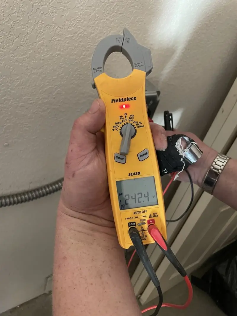 Voltage testing with clamp meter during Ceiling Fan Installation in Jupiter